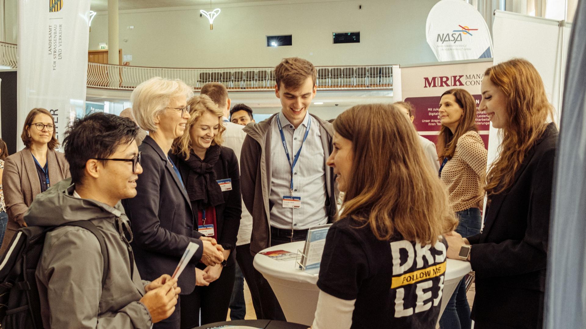 people talking at a fair stand