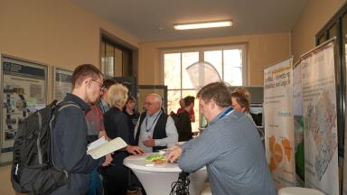 Exhibition stand with people in conversation
