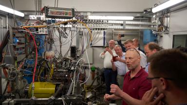 A laboratory full of cables, people visit him
