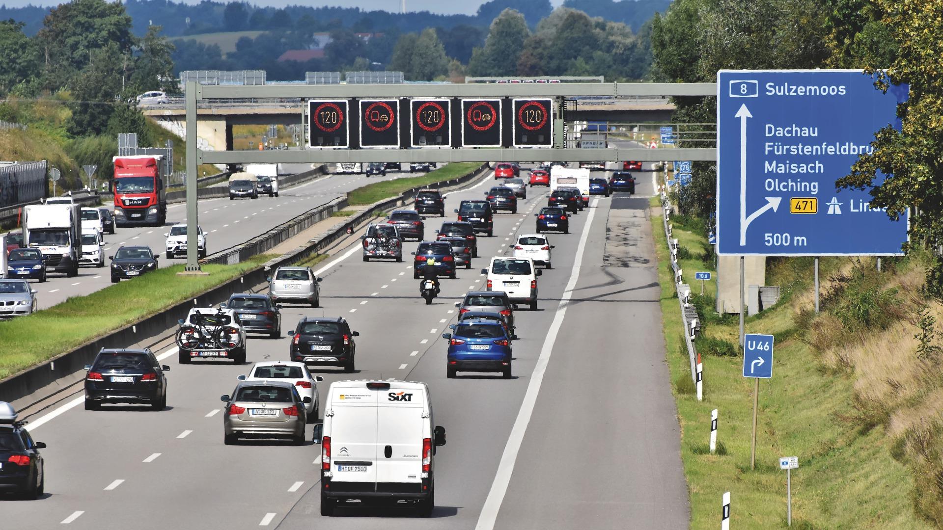 Three-lane motorway, lots of traffic, speed limit 120 on signs