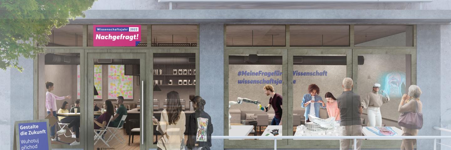 Sicht auf einen Laden von außen. Menschen draußen und drinnen.