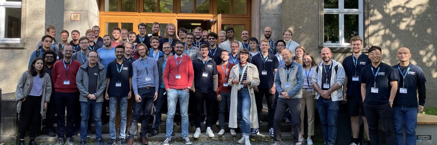 A large group of people lined up in front of a building entrance