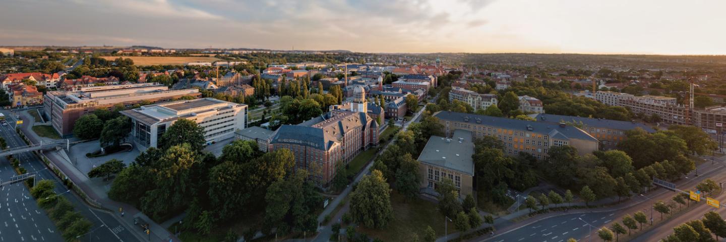 The photo shows an aerial view of some of the TU Dresden buildings. 
