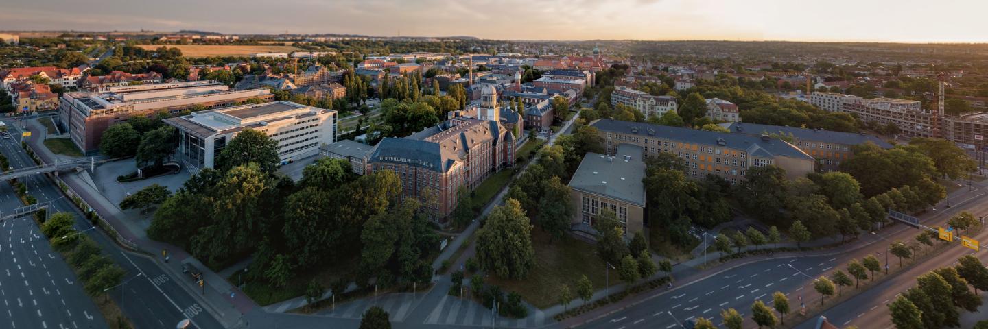 The photo shows an aerial view of some of the TU Dresden buildings.