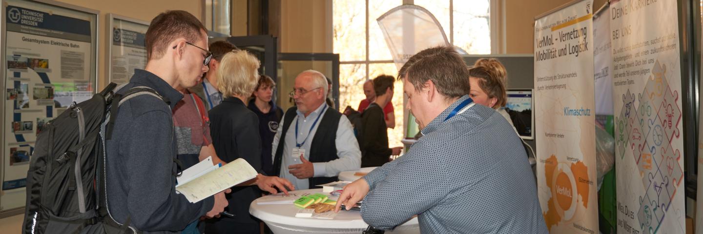 Exhibition stand with people in conversation