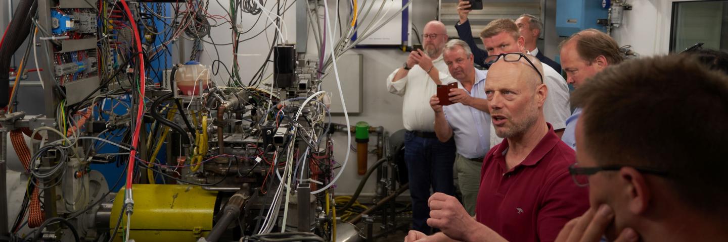 A laboratory full of cables, people visit him
