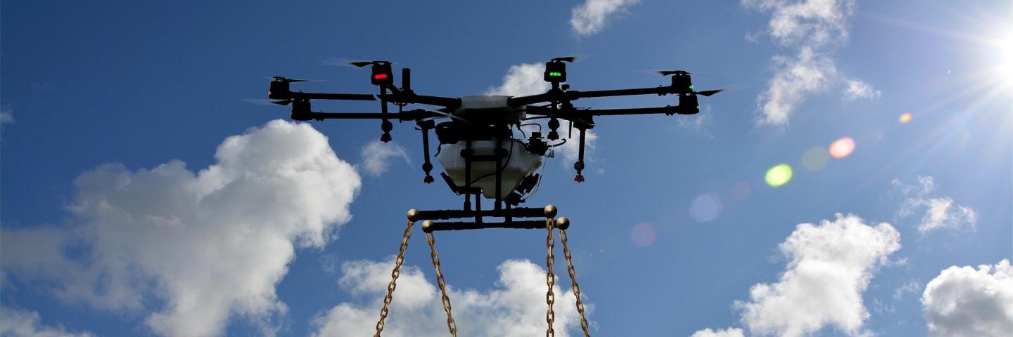 Flying drone with shopping trolley attached below