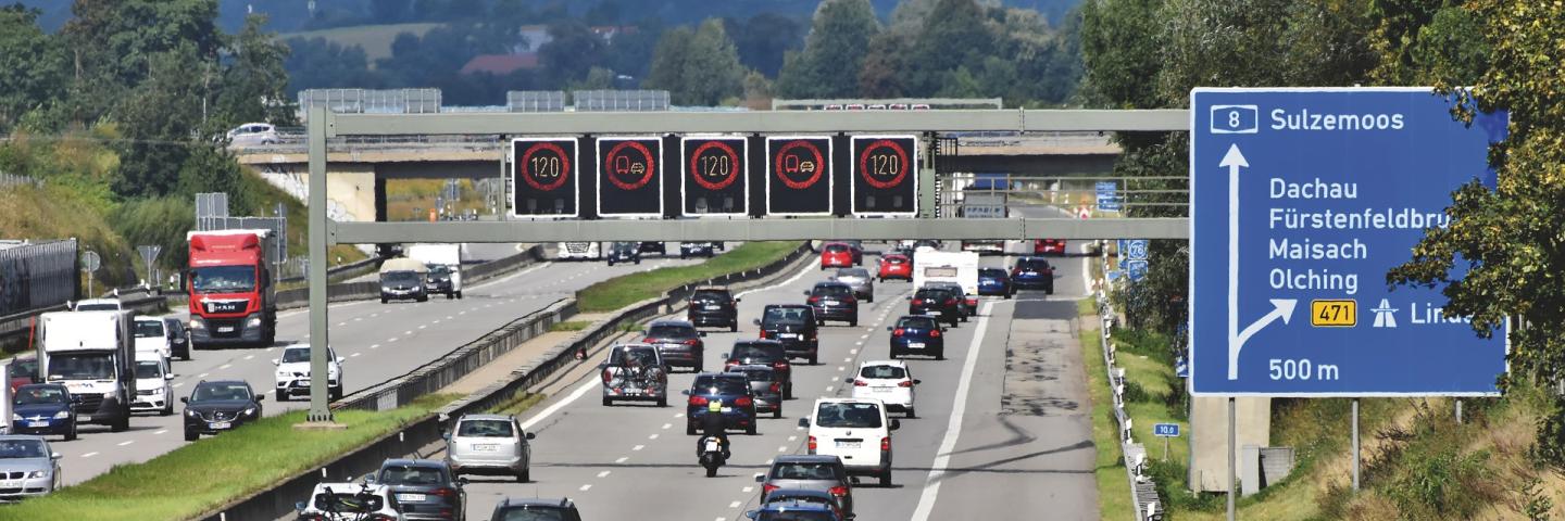 Three-lane motorway, lots of traffic, speed limit 120 on signs